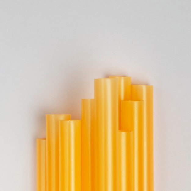 Top view stack of plastic yellow straws