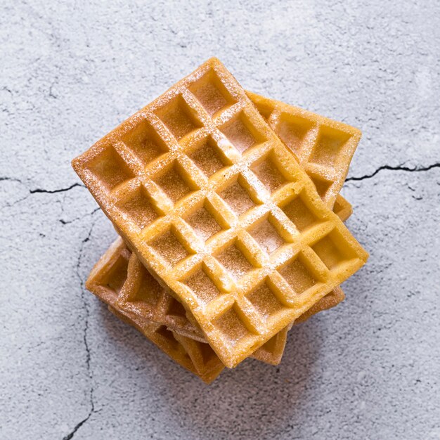 Top view of stack of waffles on concrete surface