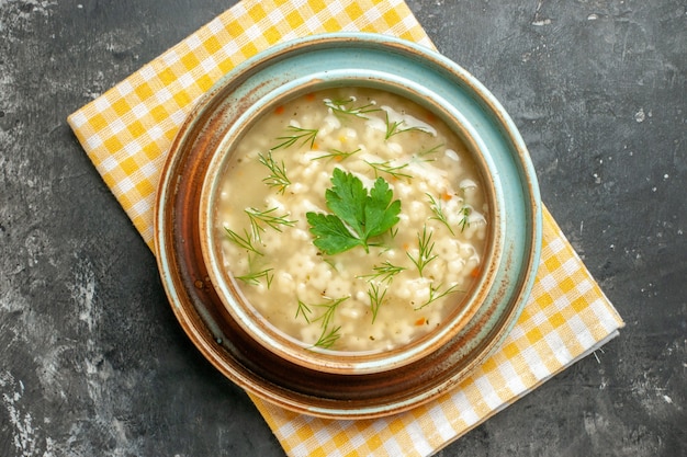 Free photo top view star soup in bowl on dark background