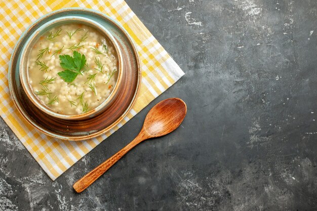 Top view star soup in bowl on dark background