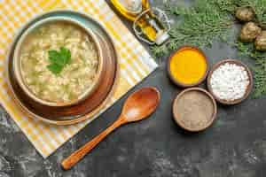 Free photo top view star soup in bowl on dark background