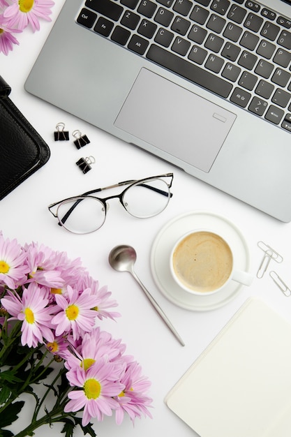 Top view stationary arrangement on desk with cup of coffee