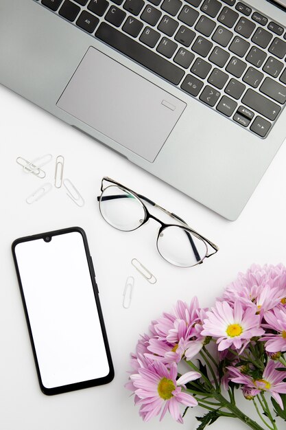 Top view stationary arrangement on desk with phone