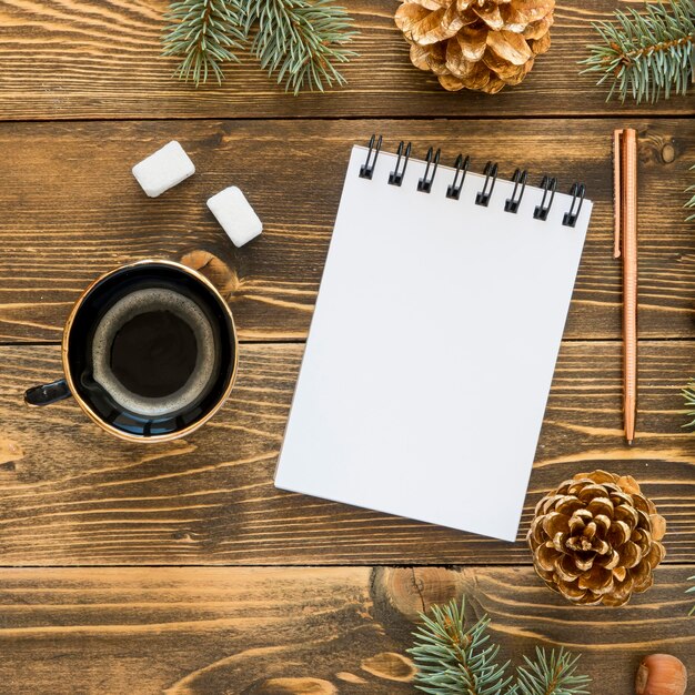 Top view stationery empty papers and cup of coffee