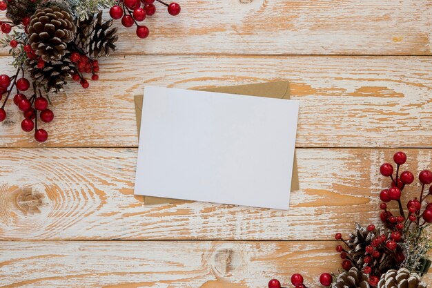 Top view stationery empty papers with christmas flowers