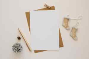 Free photo top view stationery empty papers with winter decor