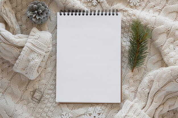 Top view stationery empty papers on woman's blouse