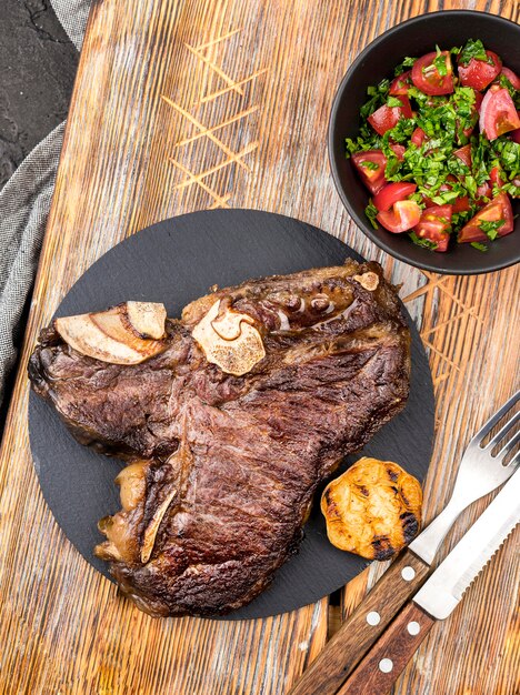 Top view of steak with salad