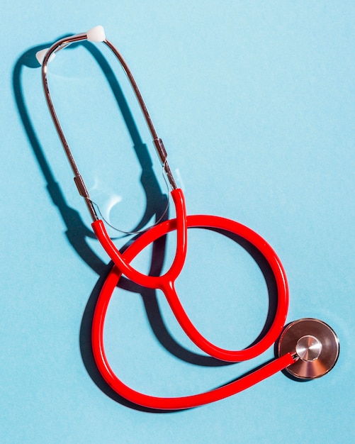 Top view stethoscope on blue background