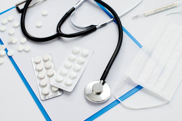 Top view stethoscope and pills