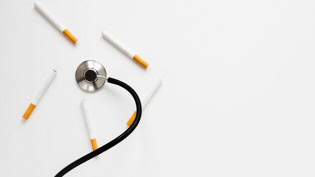 Top view stethoscope with cigarettes 