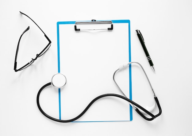 Top view stethoscope with eyeglasses and pen