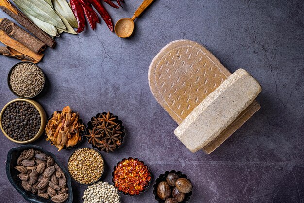 Top view of a stone board and Indian seasonings on a table
