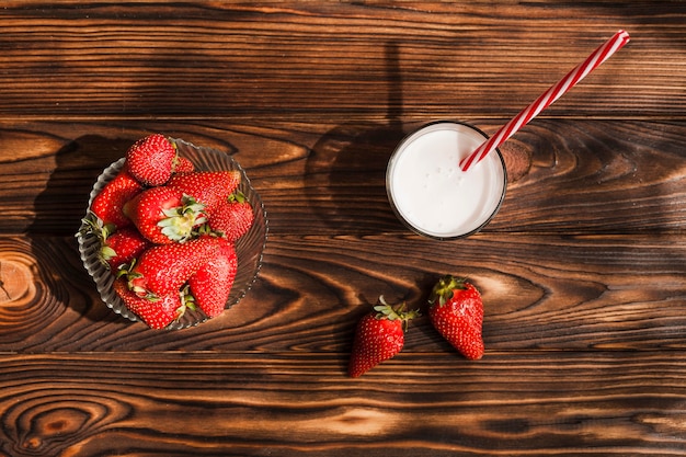 Top view strawberries on wooden background