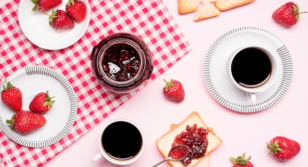 Top view strawberry jam and coffee arrangement