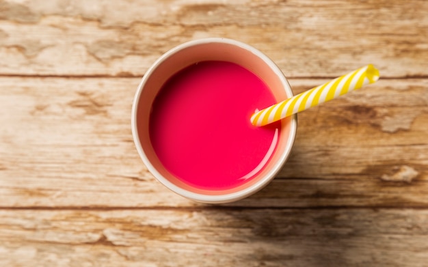 Top view strawberry smoothie in cup