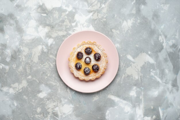 Top view sugar powdered cake with cherries on top on the light background cake pie sweet sugar bake