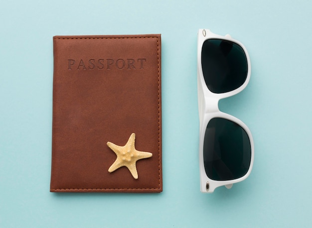 Free photo top view summer glasses and passport