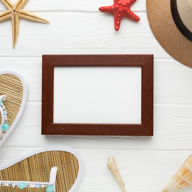 Free photo top view summer hat with frame on the table