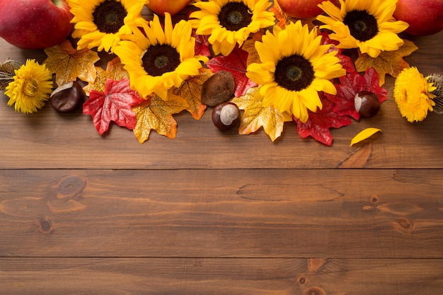 Top view of sunflowers frame with apples