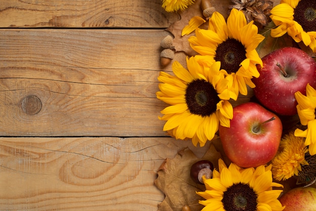 Top view of sunflowers frame with apples