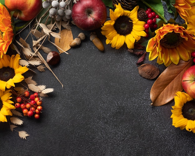 Top view of sunflowers frame with apples