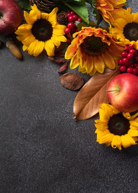 Top view of sunflowers frame with apples