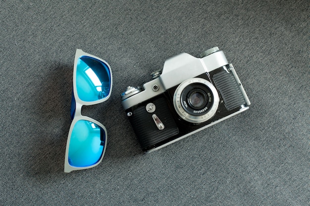 Top view of sunglasses and camera for father's day