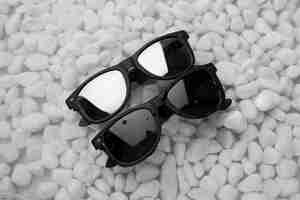 Free photo top view over sunglasses floating on water