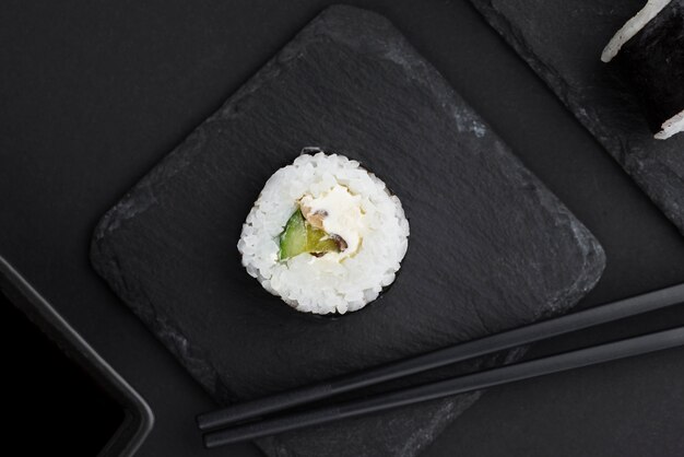 Top view of sushi roll on slate