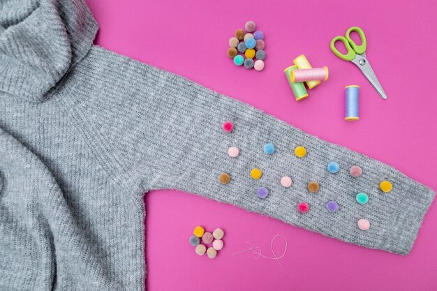 Top view sweater and colorful buttons