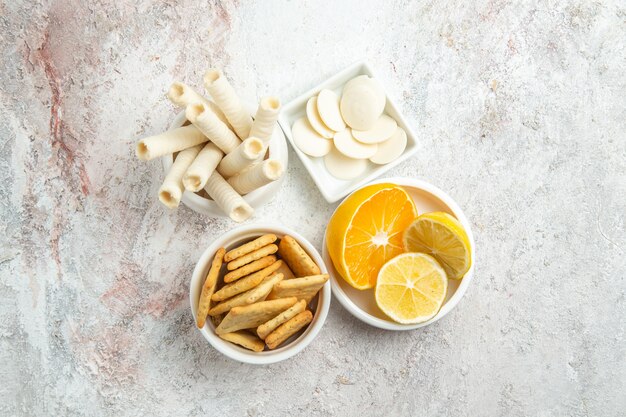 Top view sweet candies with lemon on the white table candy sweet fruit sugar