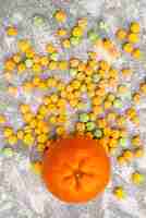 Free photo top view of sweet candies with orange on white surface