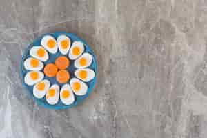 Free photo top view of sweet fresh candies on blue wooden board.