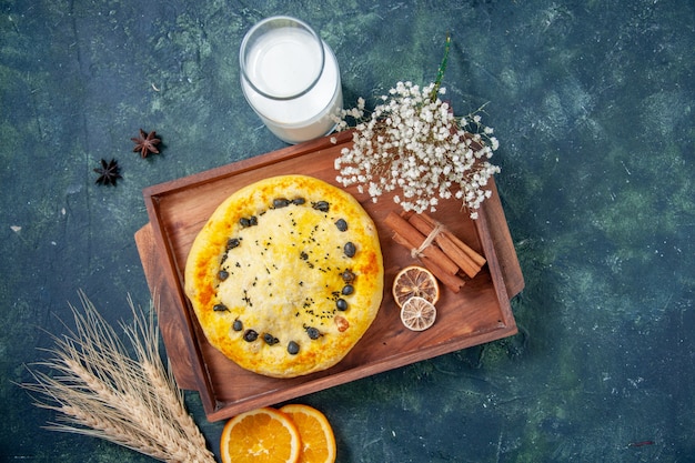 Top view sweet pie with milk on dark blue background hotcake fruit bake pie cake cookie dessert pastry bake