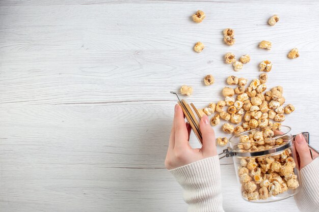 Top view sweet popcorn on light surface