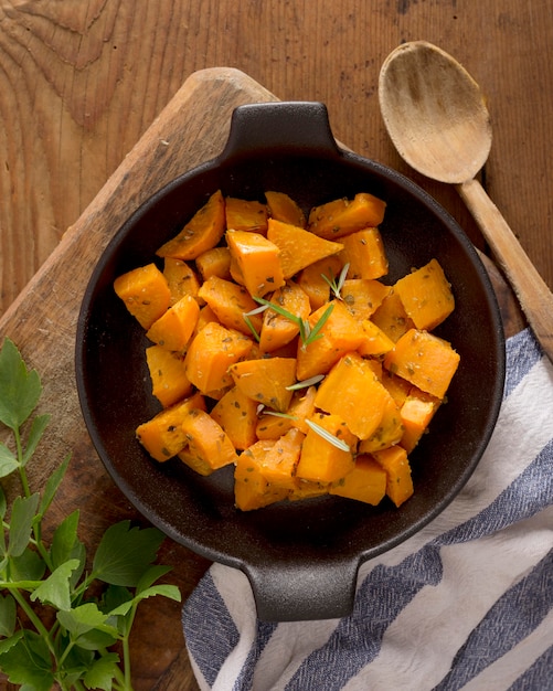 Free photo top view sweet potatoes with herbs