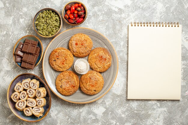 Top view sweet sand cookies with chocolate on white background