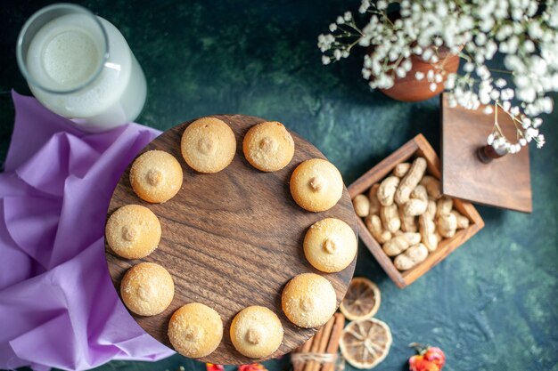 Top view sweet yummy biscuits on a dark blue background tea sugar cake pie photo dessert cookie cuisine