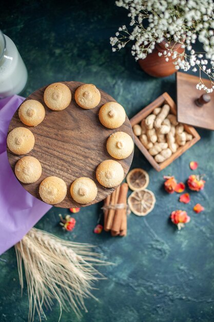 Top view sweet yummy biscuits on dark blue background tea sugar pie photo dessert cookie cuisine