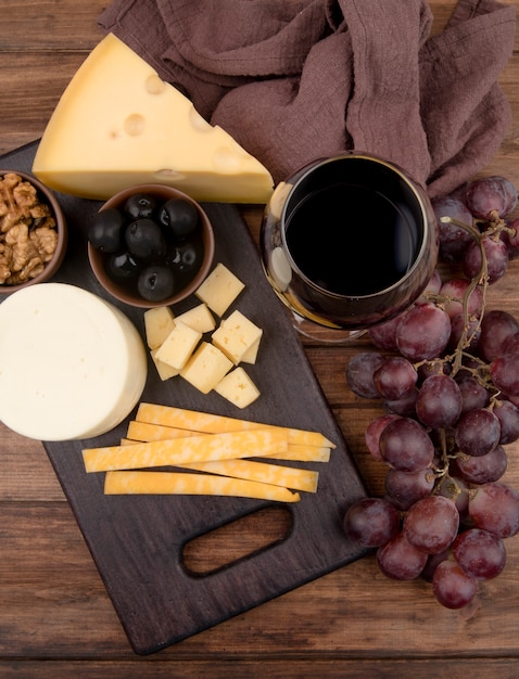 Top view table with cheese selection and wine