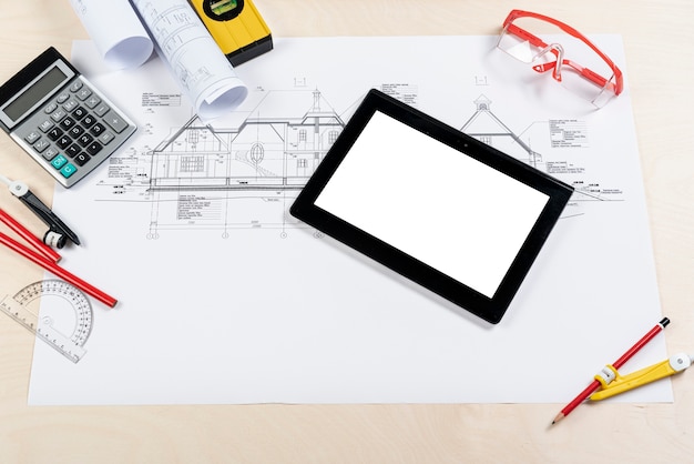 Top view tablet on top of architectural plan