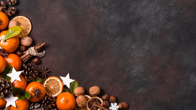 Top view of tabngerines with pine cones and walnuts for christmas