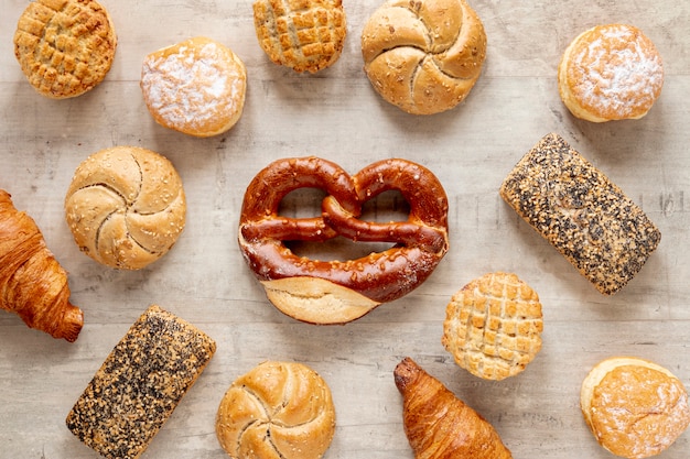 Top view tasty bagels with seeds and bread