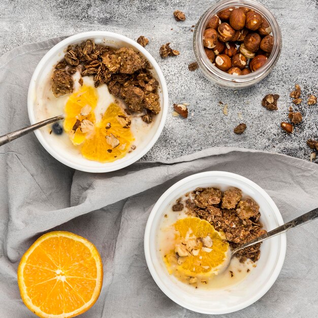 Top view tasty breakfast bowls with fruits