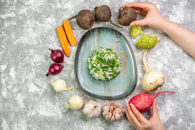 Top view tasty cabbage salad with fresh vegetables on white table