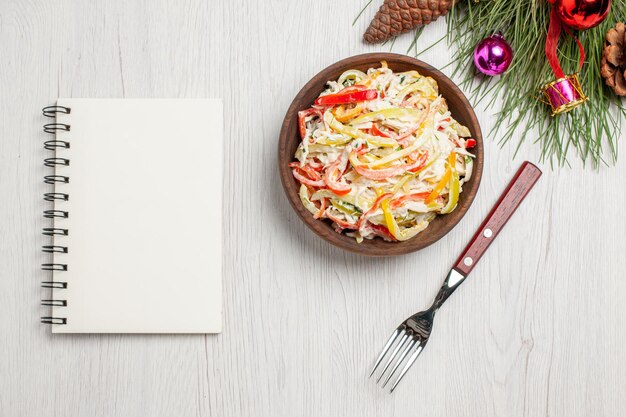 Top view tasty chicken salad with mayyonaise and sliced vegetables on a white desk fresh salad meat meal snack