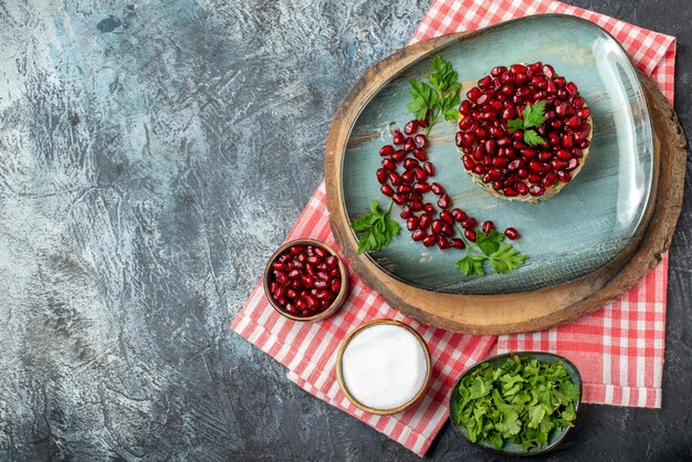 Top view tasty chicken salad with pomegranates on gray background bread food health meal salad diet holiday fruit