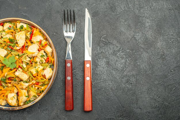 Top view tasty chicken salad with vegetables