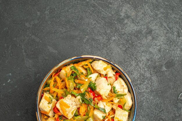 Top view tasty chicken salad with vegetables